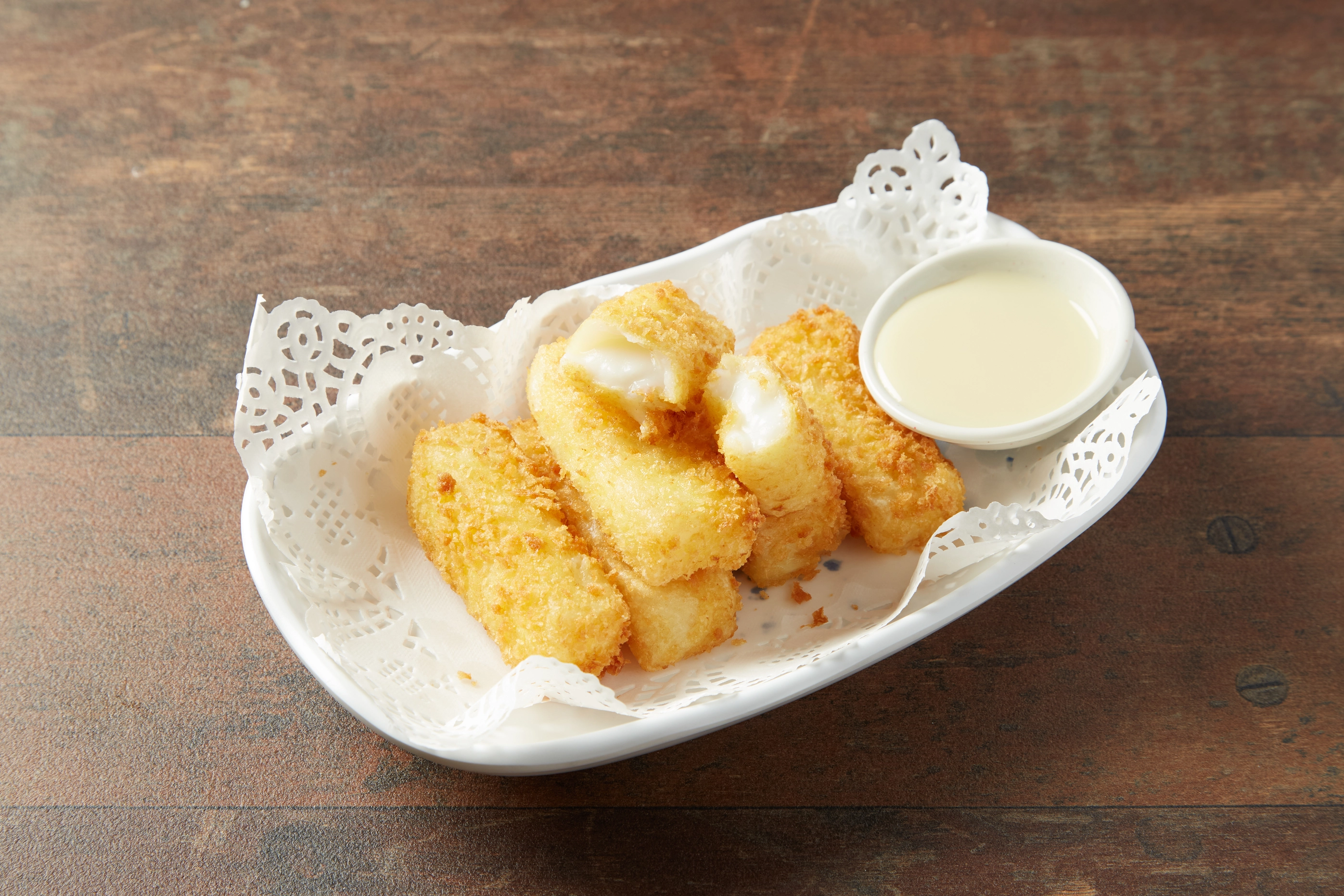 Crispy fried milk dessert dusted with sugar